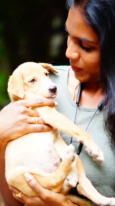 woman holding dog
